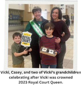 Vicki, Casey and two of Vicki's grandchildren celebrating after Vicki was crowned 2023 Royal Court Queen.