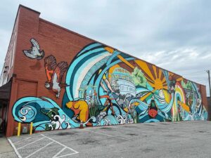 Carrie’s mural on New Albany’s two-story Token Club.