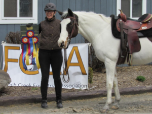 Kim Hennessy with a horse.